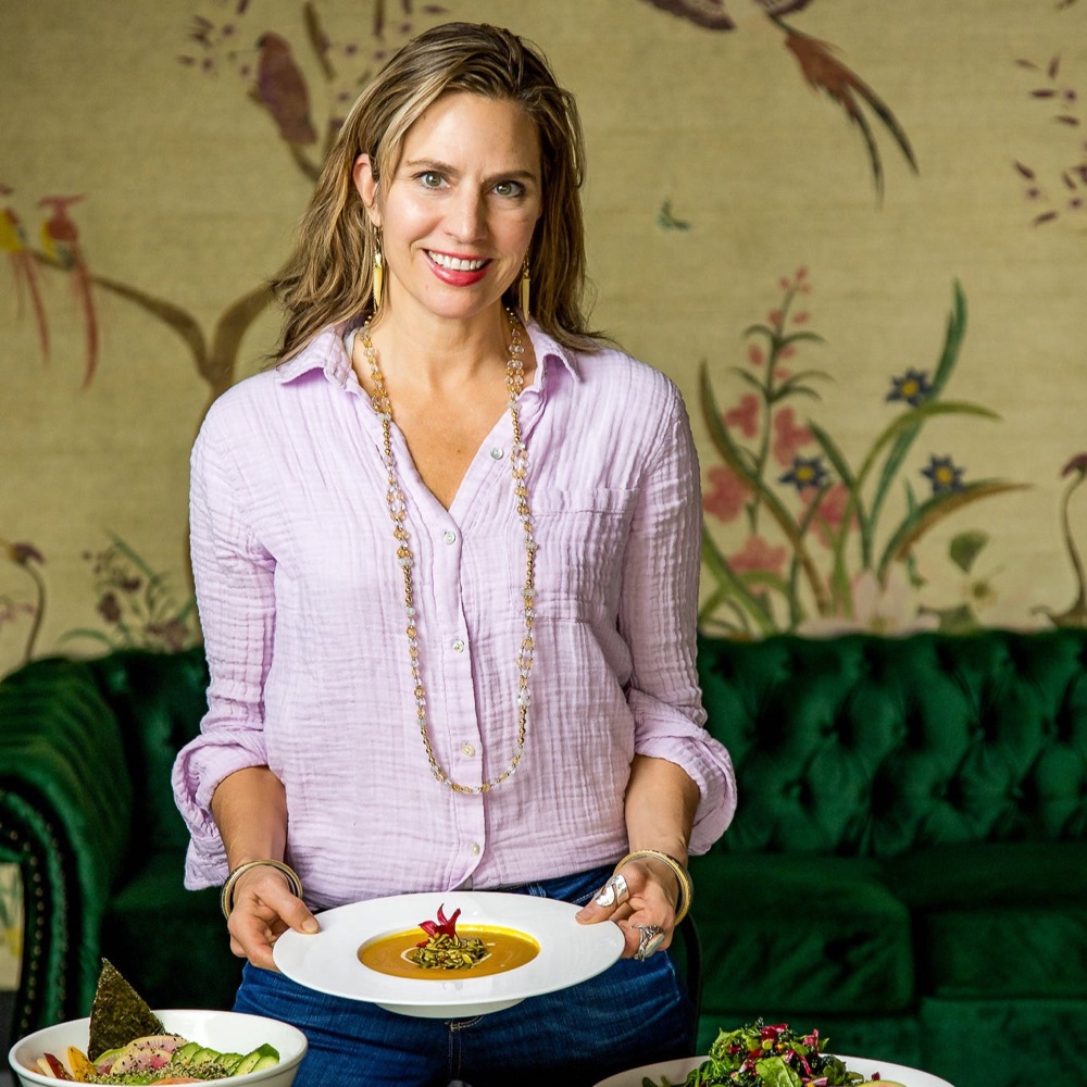 Chef Sarah Ann Haugen holding a bowl of soup